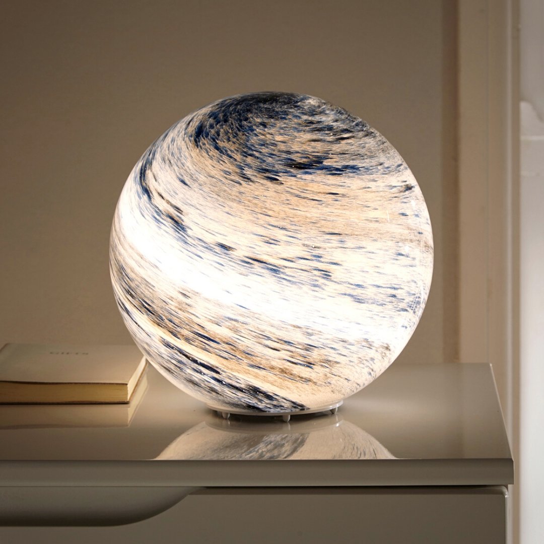 LED table lamp featuring a unique swirl pattern and soft glow, designed with an elegant glass-look finish, perfect for bedside or desk use. 0