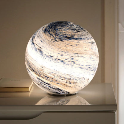 LED table lamp featuring a unique swirl pattern and soft glow, designed with an elegant glass-look finish, perfect for bedside or desk use. 0