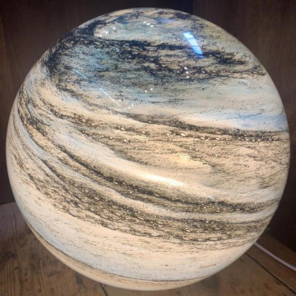 LED table lamp featuring a unique swirl pattern and soft glow, designed with an elegant glass-look finish, perfect for bedside or desk use. 6