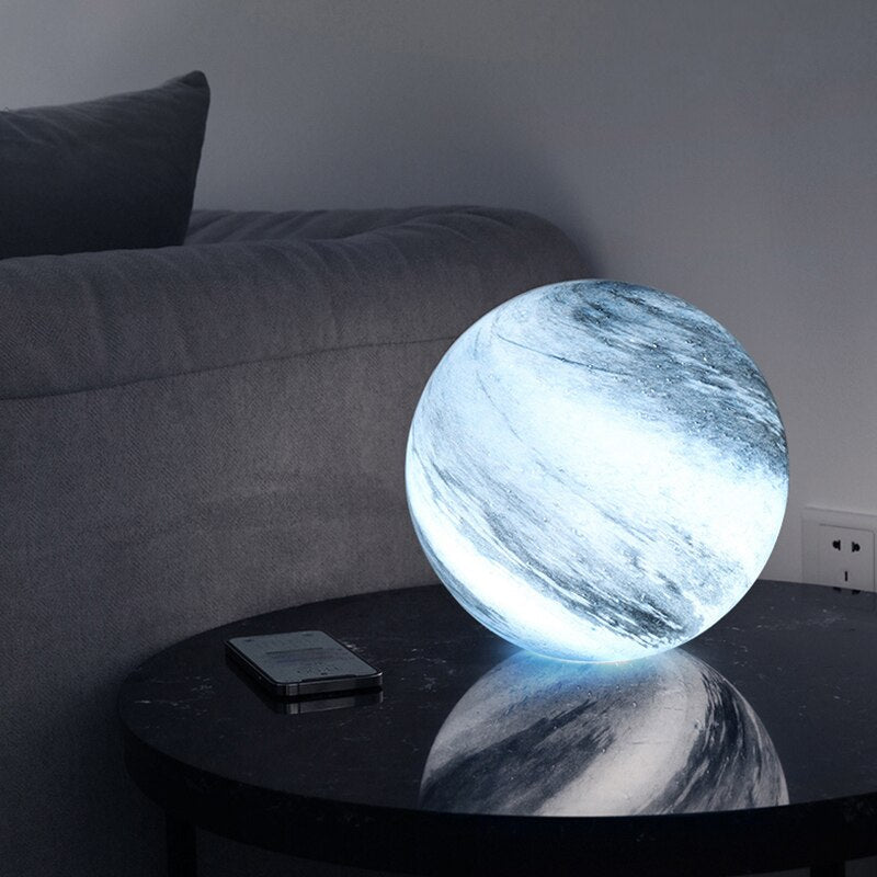 LED table lamp featuring a unique swirl pattern and soft glow, designed with an elegant glass-look finish, perfect for bedside or desk use. 3
