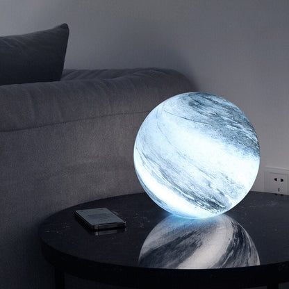 LED table lamp featuring a unique swirl pattern and soft glow, designed with an elegant glass-look finish, perfect for bedside or desk use. 3