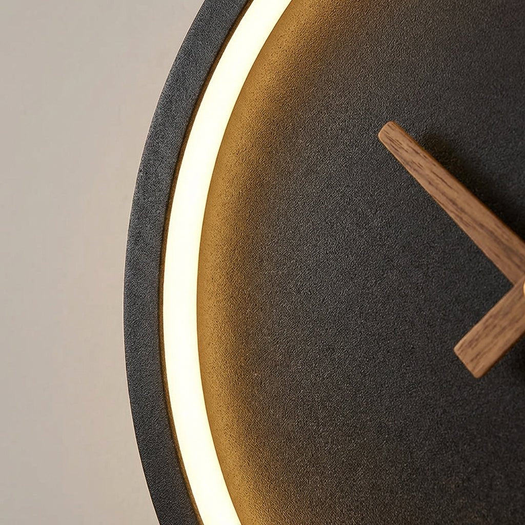 Modern minimalist LED wall clock featuring integrated warm white lighting, measuring 27x25cm, perfect for stylish home decor. 3