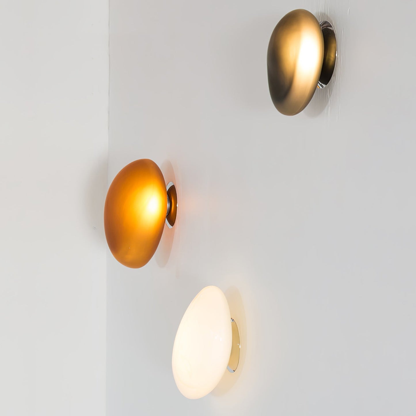 LED wall lamp featuring an adjustable light color, designed with a sleek oval shape in metal and glass, perfect for modern home decor. 4
