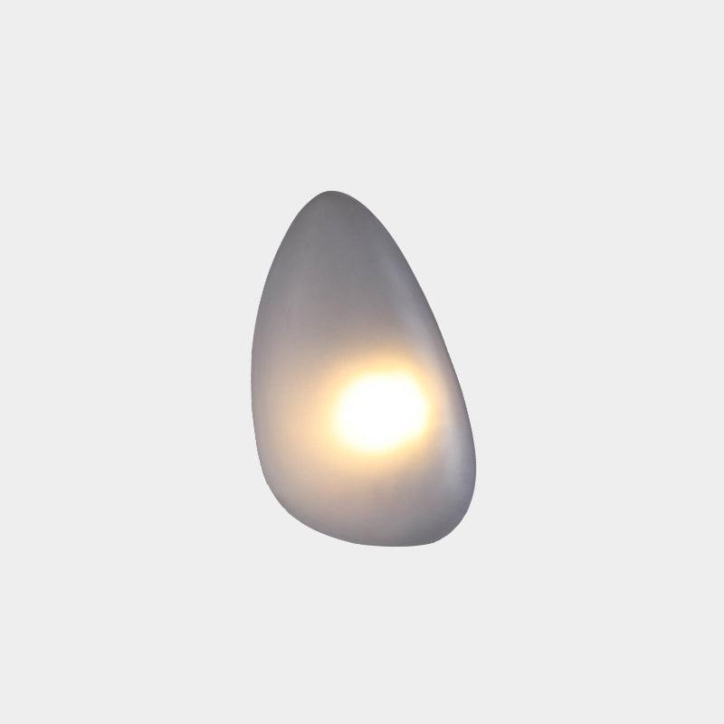LED wall lamp featuring an adjustable light color, designed with a sleek oval shape in metal and glass, perfect for modern home decor. 12