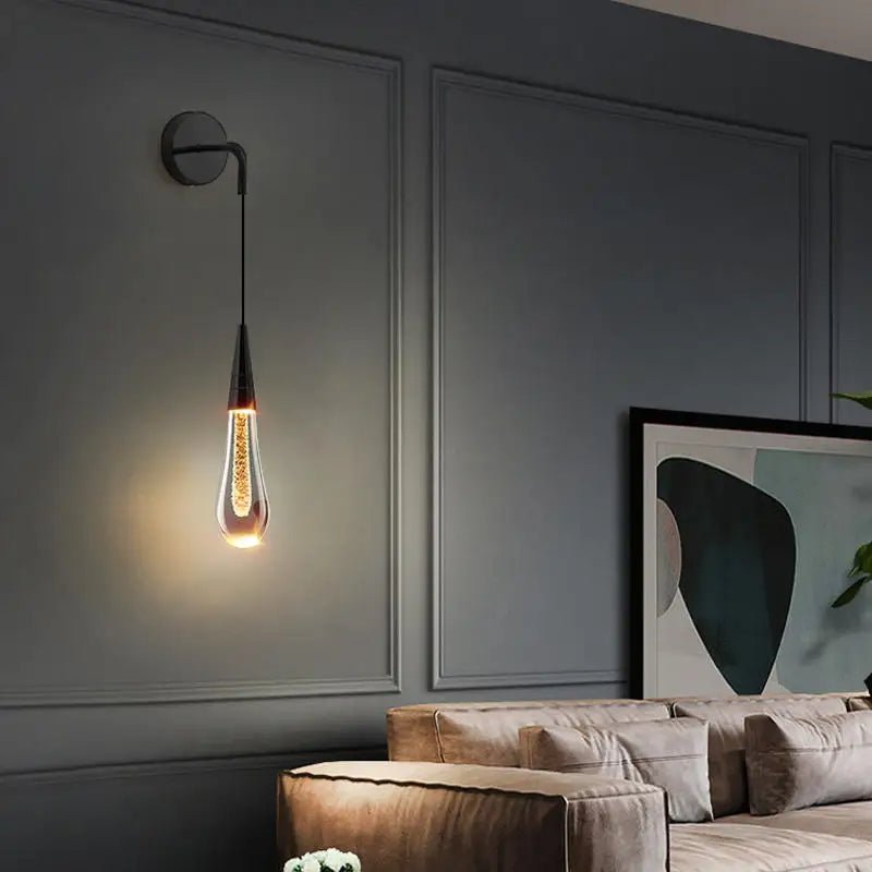 LED wall lamp featuring warm light and elegant gold accents, designed in a modern waterdrop shape with a combination of glass and metal materials, perfect for contemporary 5