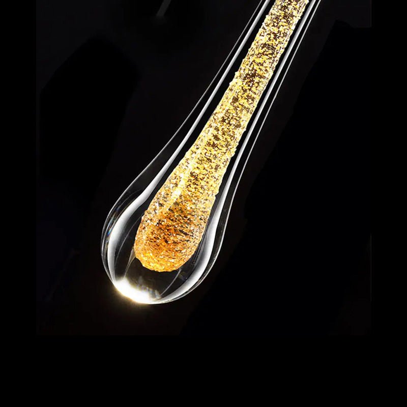 LED wall lamp featuring warm light and elegant gold accents, designed in a modern waterdrop shape with a combination of glass and metal materials, perfect for contemporary 2