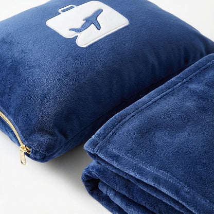 Lightweight travel set featuring a soft pillow and blanket, designed for comfort on the go with a compact and portable design. 3