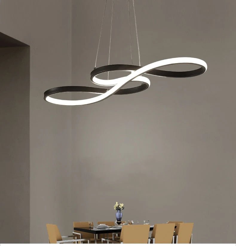 Modern black metal linear pendant light with adjustable cable, perfect for illuminating kitchens or living rooms. 4