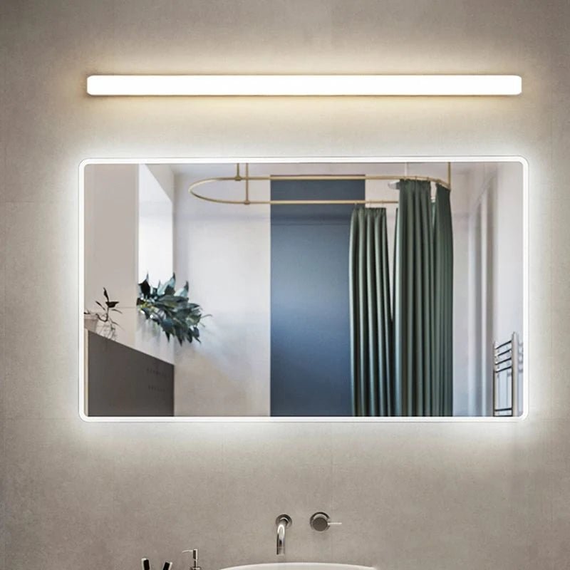 Linear wall light featuring an acrylic diffuser, designed for bathroom use, IP44 rated for moisture resistance, offering soft illumination in a sleek white finish. 3