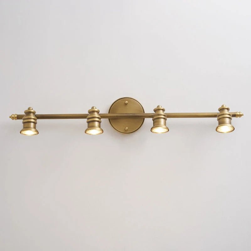 Linear wall light featuring adjustable spotlight heads in a warm brass finish, perfect for bathroom and indoor use, enhancing modern decor and providing focused illumination. 9