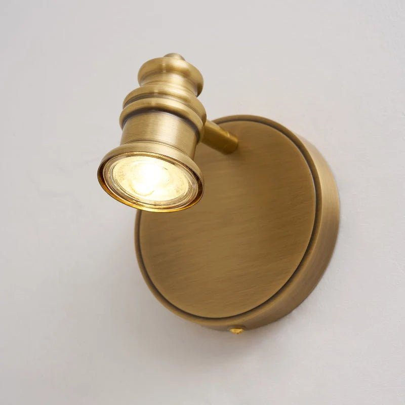 Linear wall light featuring adjustable spotlight heads in a warm brass finish, perfect for bathroom and indoor use, enhancing modern decor and providing focused illumination. 0