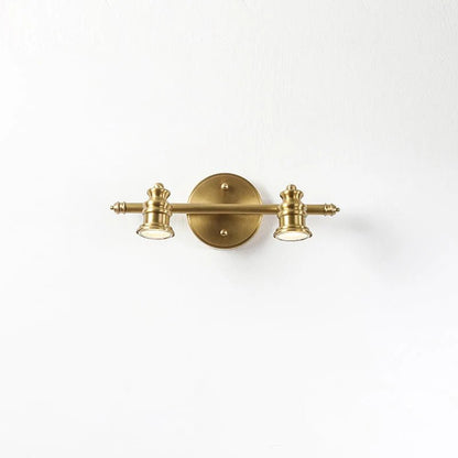 Linear wall light featuring adjustable spotlight heads in a warm brass finish, perfect for bathroom and indoor use, enhancing modern decor and providing focused illumination. 10