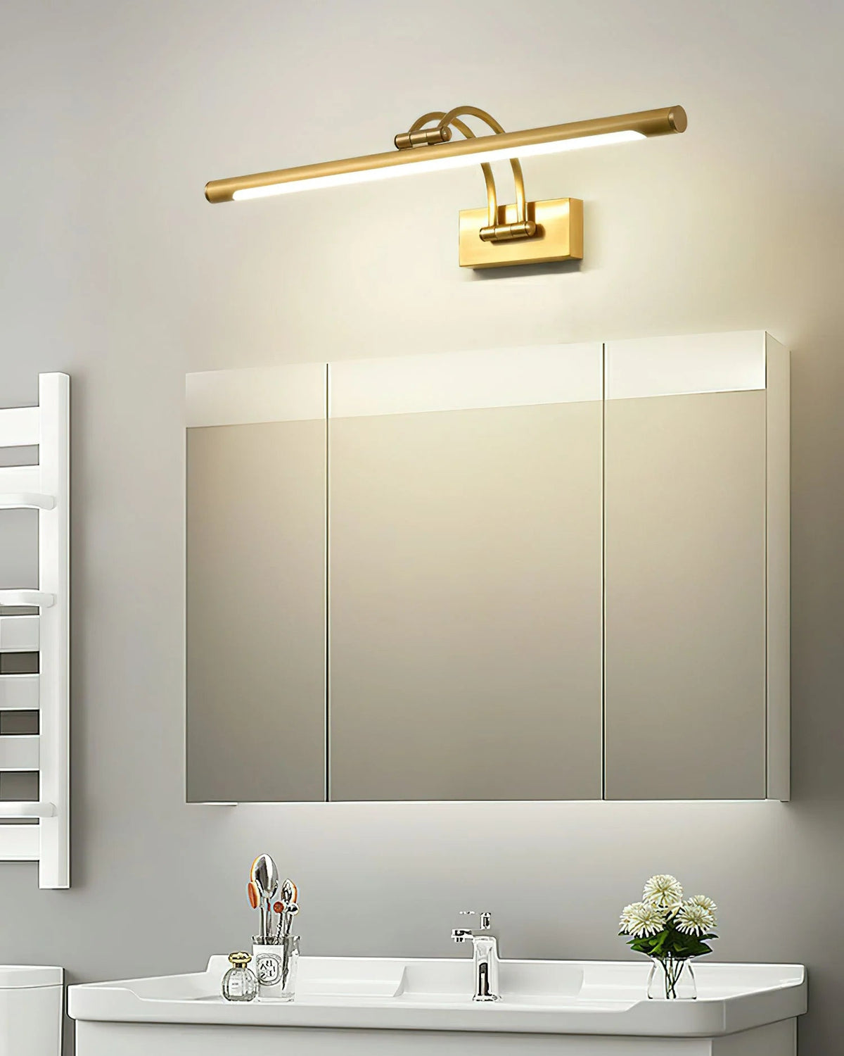 Linear wall light featuring a sleek design with a dimmable integrated LED, available in a modern brass or dark bronze finish, perfect for enhancing bathroom ambiance 7