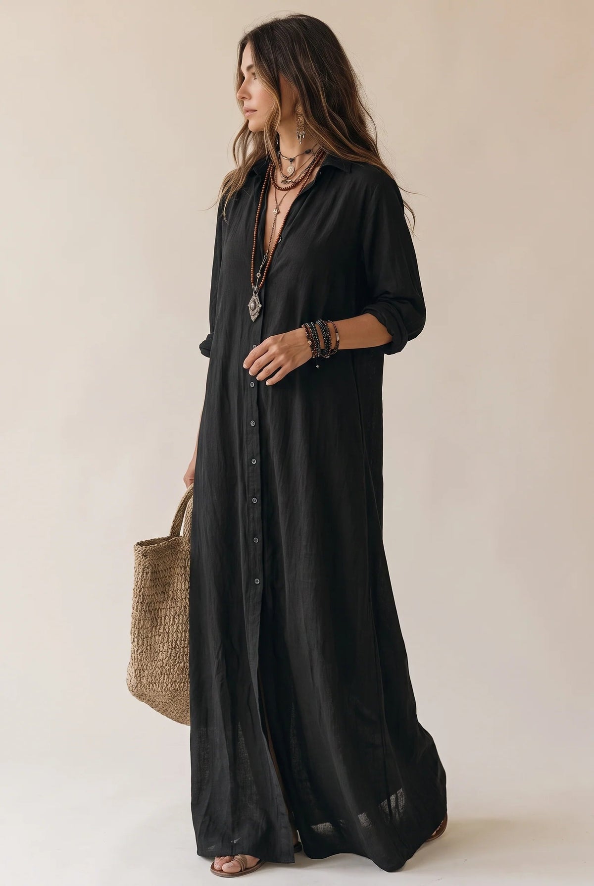 Long button-down shirt dress with adjustable collar in black and white, featuring a loose fit maxi design perfect for casual or semi-formal occasions. 0