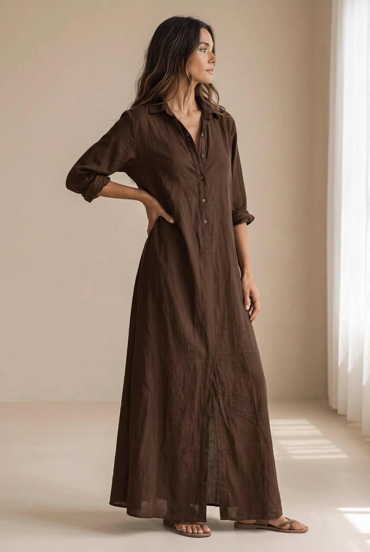 Long button-down shirt dress with adjustable collar in black and white, featuring a loose fit maxi design perfect for casual or semi-formal occasions. 10