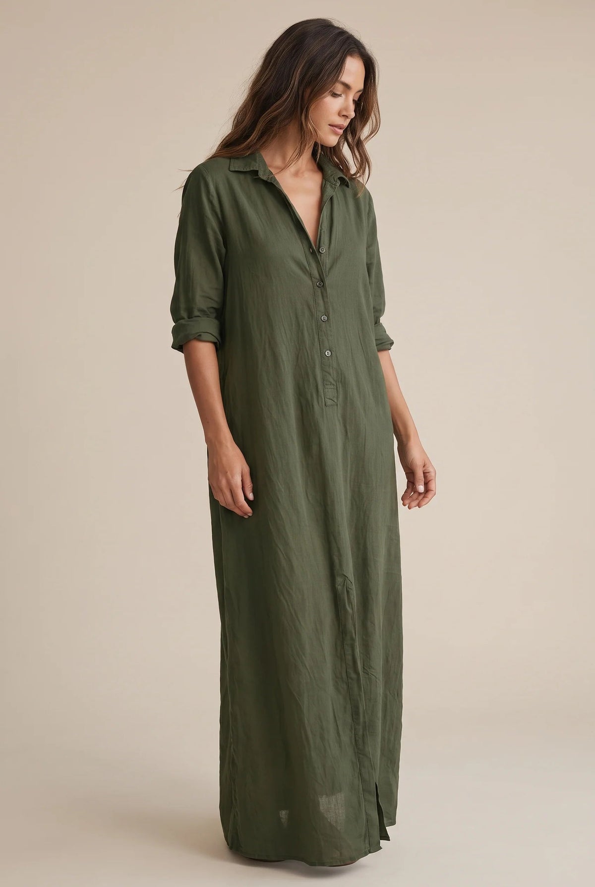 Long button-down shirt dress with adjustable collar in black and white, featuring a loose fit maxi design perfect for casual or semi-formal occasions. 11