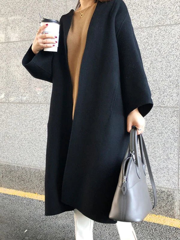 Long wool coat for women featuring a relaxed fit and minimalist design, perfect for autumn and winter fashion. 5