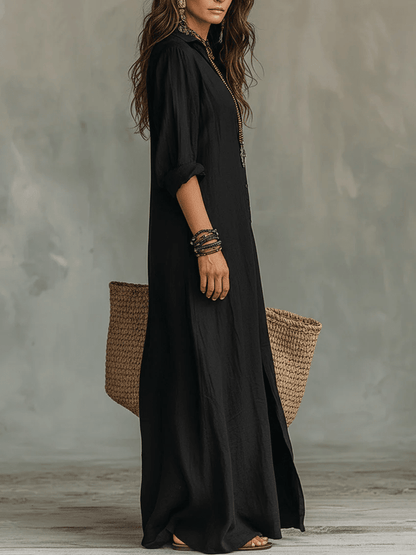 Loose black maxi dress featuring elegant buttons, designed for a flowing fit perfect for special occasions. 1