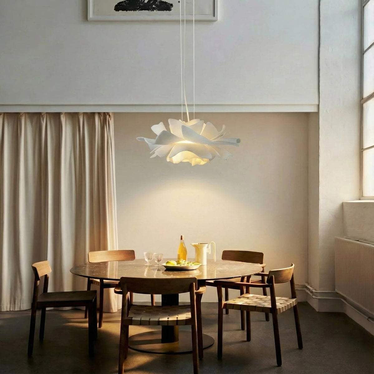 Lotus Pendant Light with adjustable cord, featuring a modern white acrylic design, perfect for illuminating kitchen and dining spaces. 3