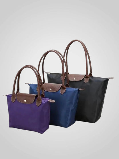 Luxury shoulder bag crafted from high-quality leather featuring a spacious interior and elegant design, perfect for everyday use. 1