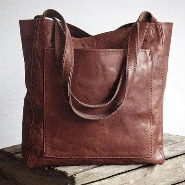 Maxi leather shoulder bag for women in classic natural leather, featuring a spacious design and a long strap, ideal for work or travel. 1