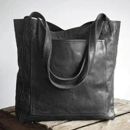 Maxi leather shoulder bag for women in classic natural leather, featuring a spacious design and a long strap, ideal for work or travel. 2