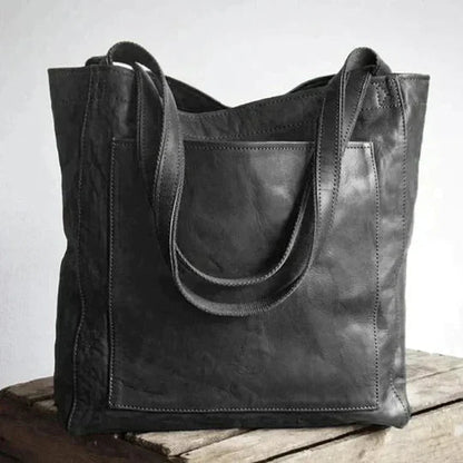 Maxi leather shoulder bag for women in classic natural leather, featuring a spacious design and a long strap, ideal for work or travel. 2