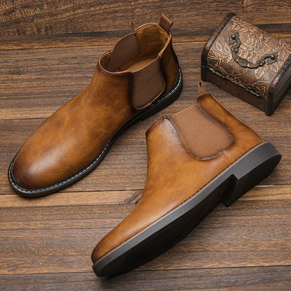 Men's Chelsea boots featuring a classic genuine leather design, elastic side panel for easy wear, and a sturdy rubber sole for durability and comfort. 0
