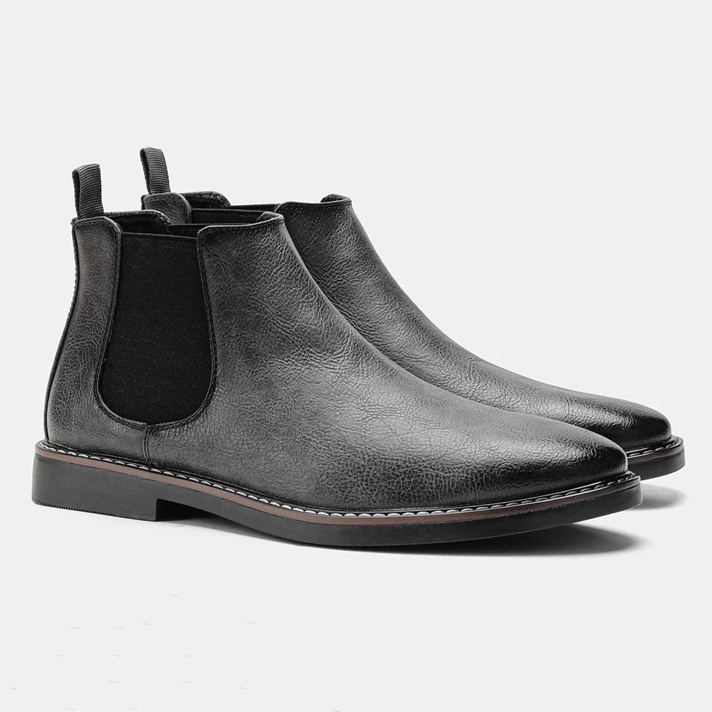 Men's Chelsea boots featuring a classic genuine leather design, elastic side panel for easy wear, and a sturdy rubber sole for durability and comfort. 7