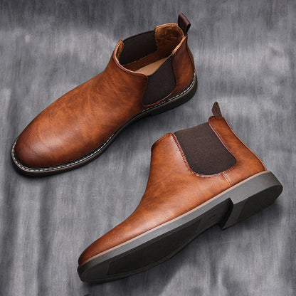 Men's Chelsea boots featuring a classic genuine leather design, elastic side panel for easy wear, and a sturdy rubber sole for durability and comfort. 3