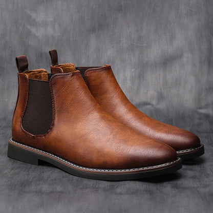 Men's Chelsea boots featuring a classic genuine leather design, elastic side panel for easy wear, and a sturdy rubber sole for durability and comfort. 1