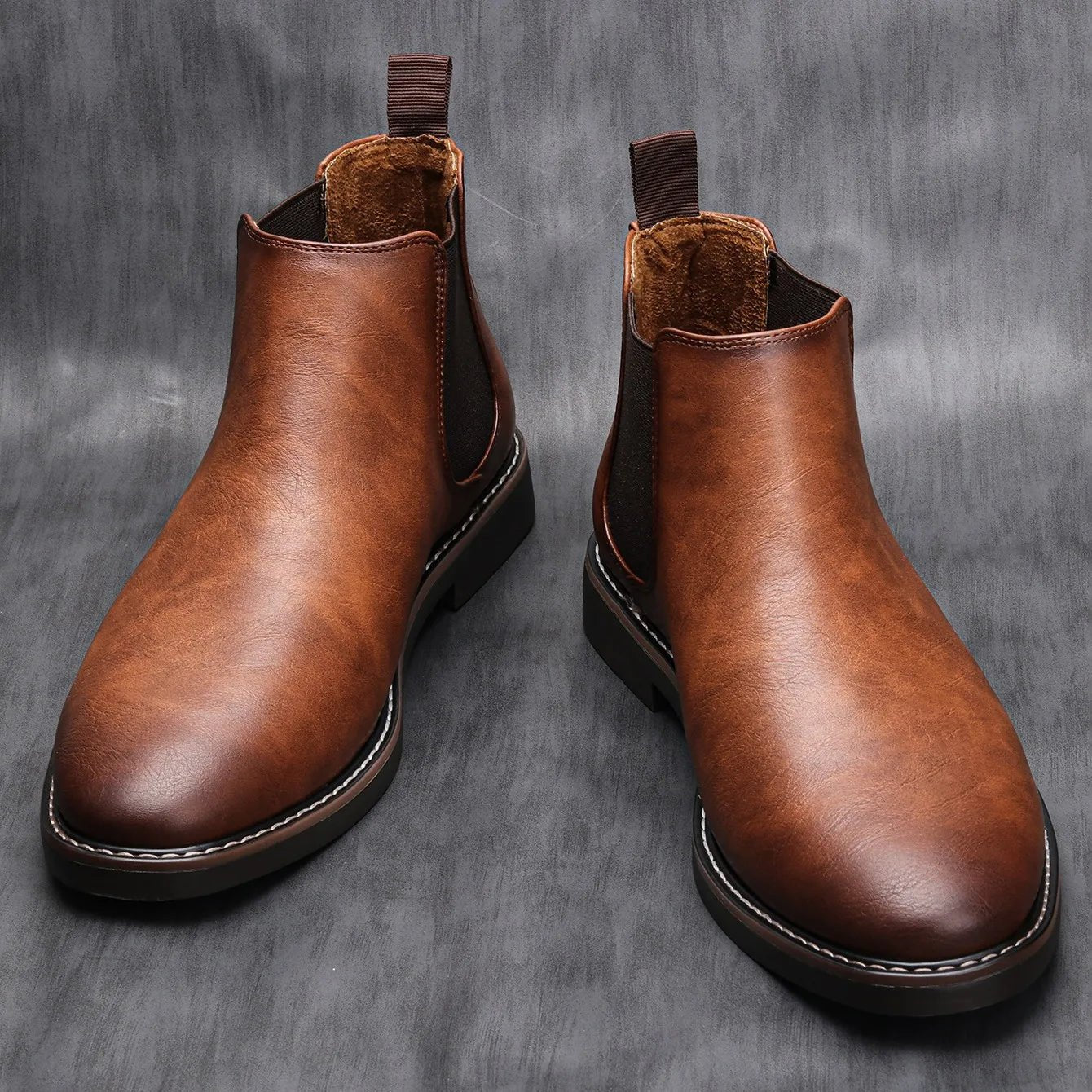 Men's Chelsea boots featuring a classic genuine leather design, elastic side panel for easy wear, and a sturdy rubber sole for durability and comfort. 2