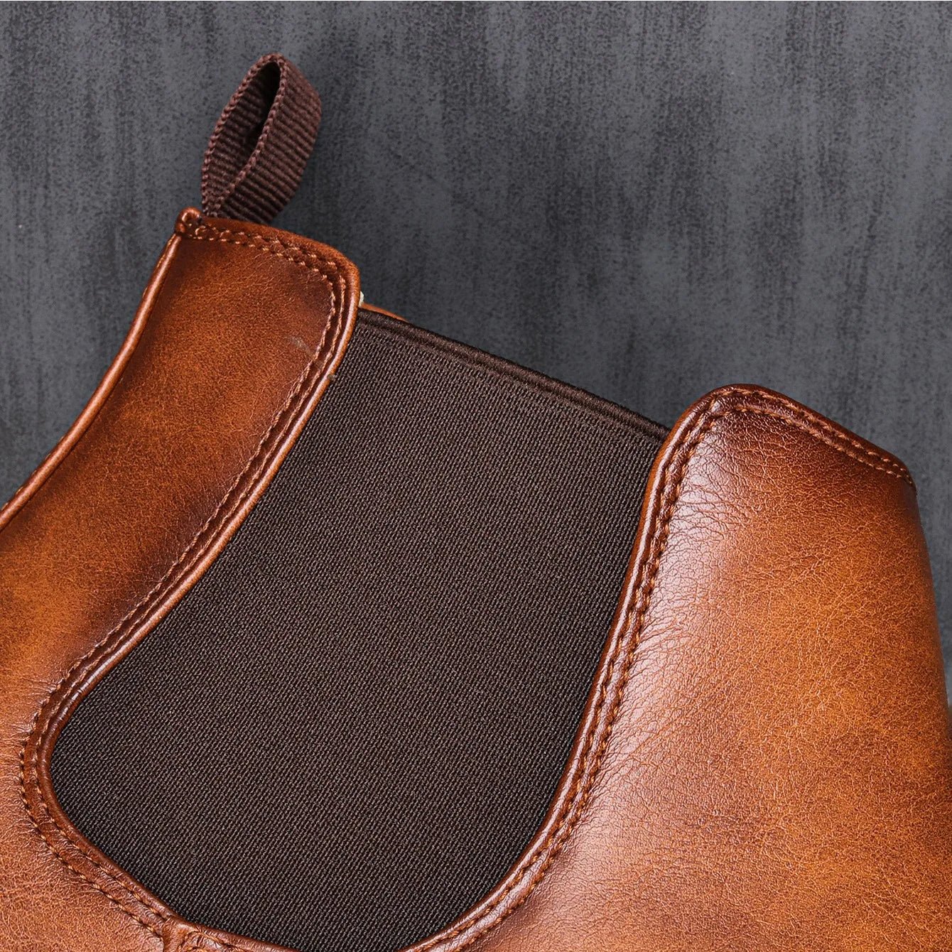 Men's Chelsea boots featuring a classic genuine leather design, elastic side panel for easy wear, and a sturdy rubber sole for durability and comfort. 4