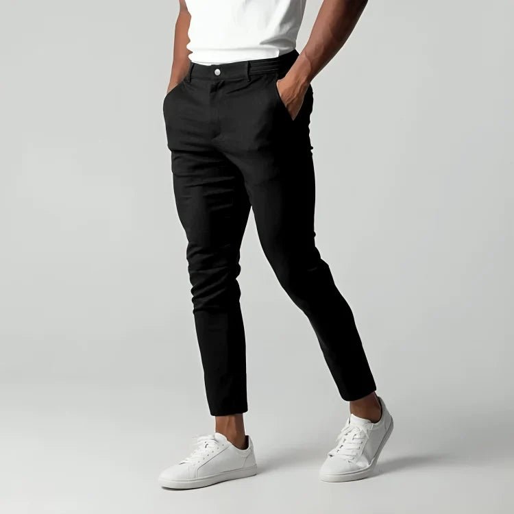 Men's slim fit chino pants with tapered leg design, made from stretch fabric for all-day comfort and style. 0