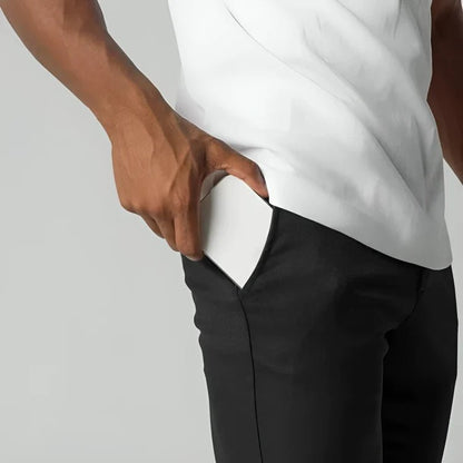 Men's slim fit chino pants with tapered leg design, made from stretch fabric for all-day comfort and style. 3