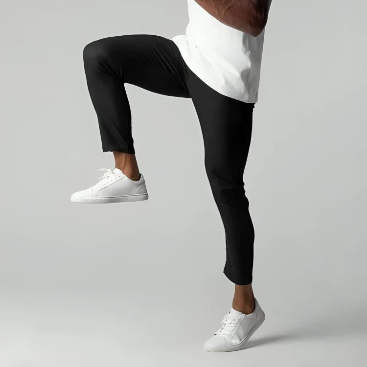 Men's slim fit chino pants with tapered leg design, made from stretch fabric for all-day comfort and style. 2