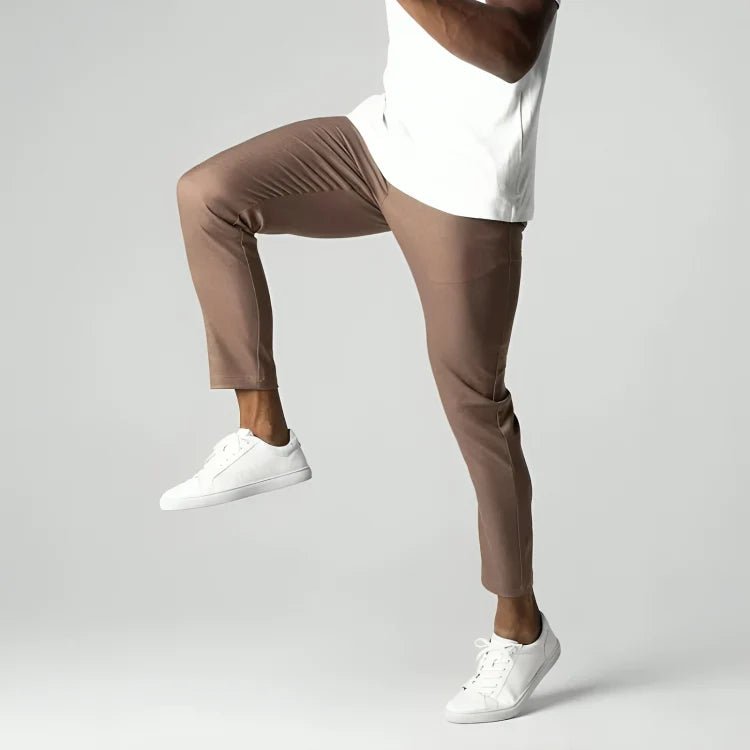 Men's slim fit chino pants with tapered leg design, made from stretch fabric for all-day comfort and style. 6