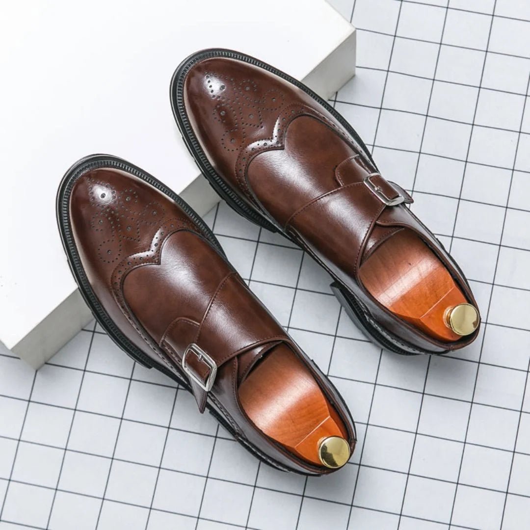 Men's black leather dress shoes featuring a single-buckle closure and intricate brogue detailing, designed in a stylish wingtip monk-strap style. 4