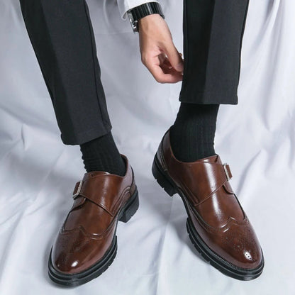 Men's black leather dress shoes featuring a single-buckle closure and intricate brogue detailing, designed in a stylish wingtip monk-strap style. 5