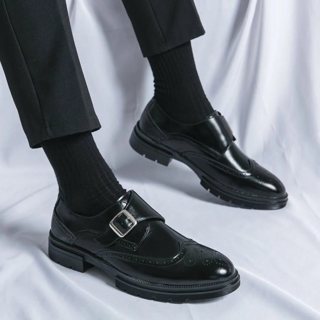 Men's black leather dress shoes featuring a single-buckle closure and intricate brogue detailing, designed in a stylish wingtip monk-strap style. 3