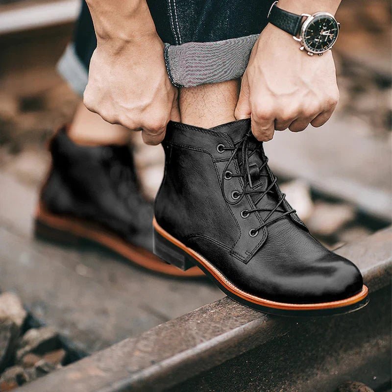 Men's high-top leather boots featuring a cushioned footbed, ideal for urban and outdoor wear, available in black and brown colors. 3