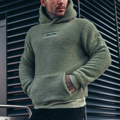 Men's hoodie featuring a relaxed fit and soft plush fabric, perfect for comfortable casual wear. 0