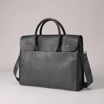 Men's laptop bag featuring a durable PU leather retro design, equipped with an adjustable strap, designed to fit 14-inch laptops. 2