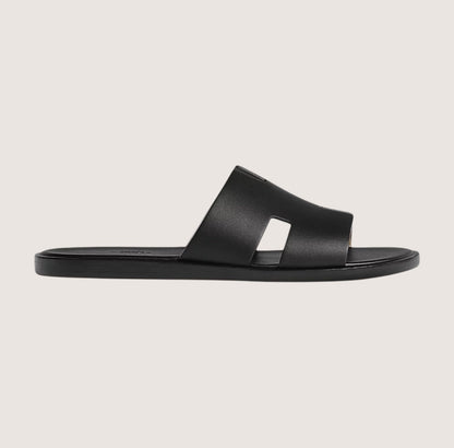 Men's black leather slide sandals featuring a cushioned insole and open-toe design, perfect for casual and smart-casual occasions. 1