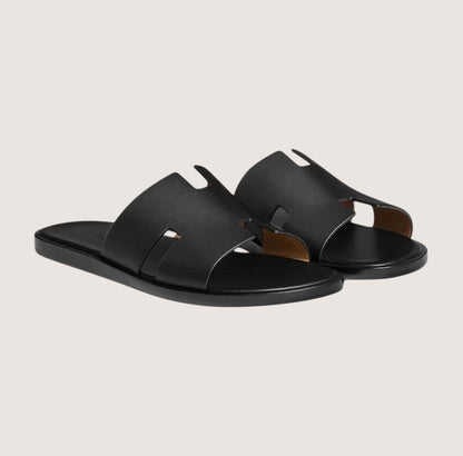 Men's black leather slide sandals featuring a cushioned insole and open-toe design, perfect for casual and smart-casual occasions. 0
