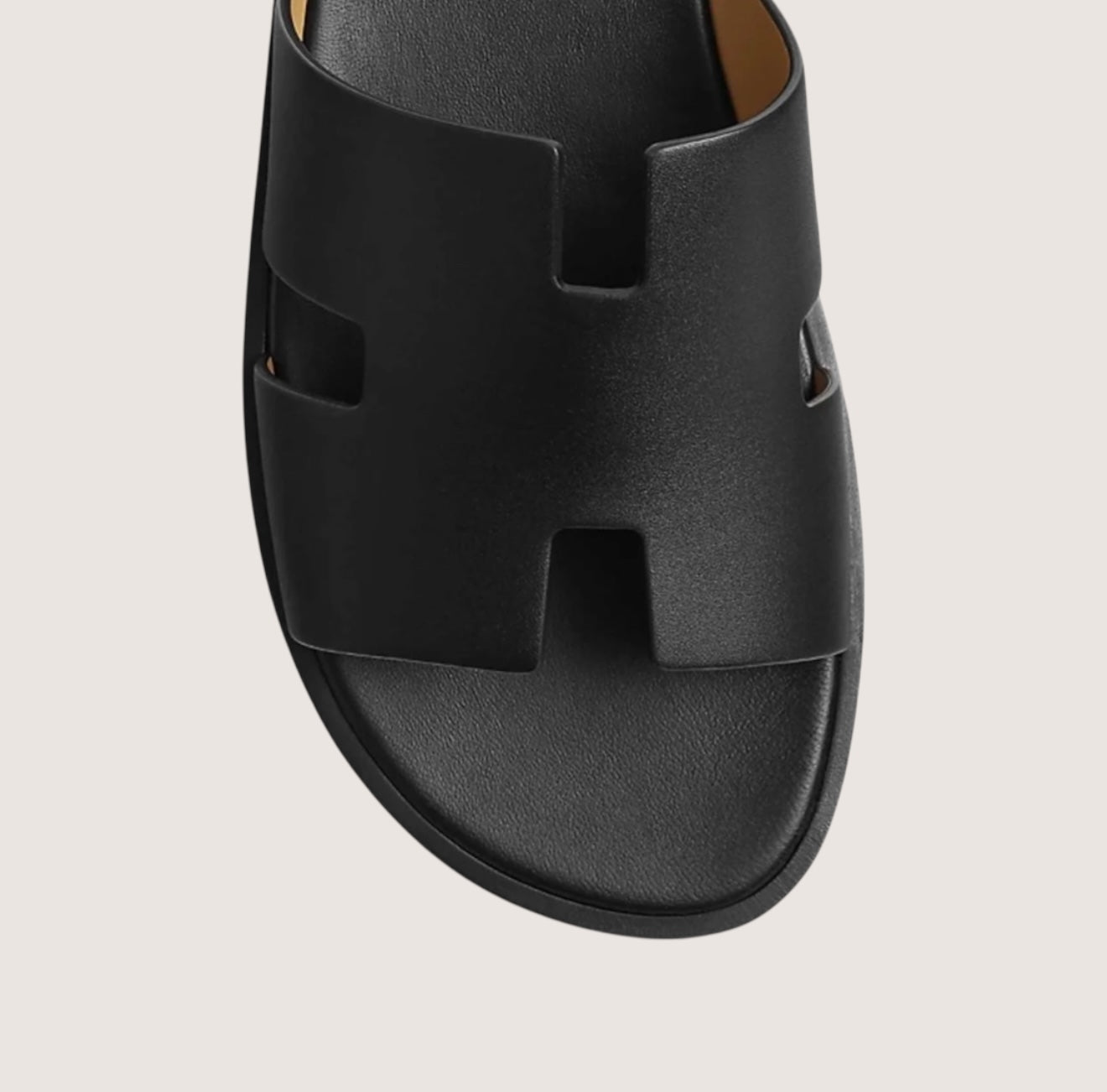Men's black leather slide sandals featuring a cushioned insole and open-toe design, perfect for casual and smart-casual occasions. 2