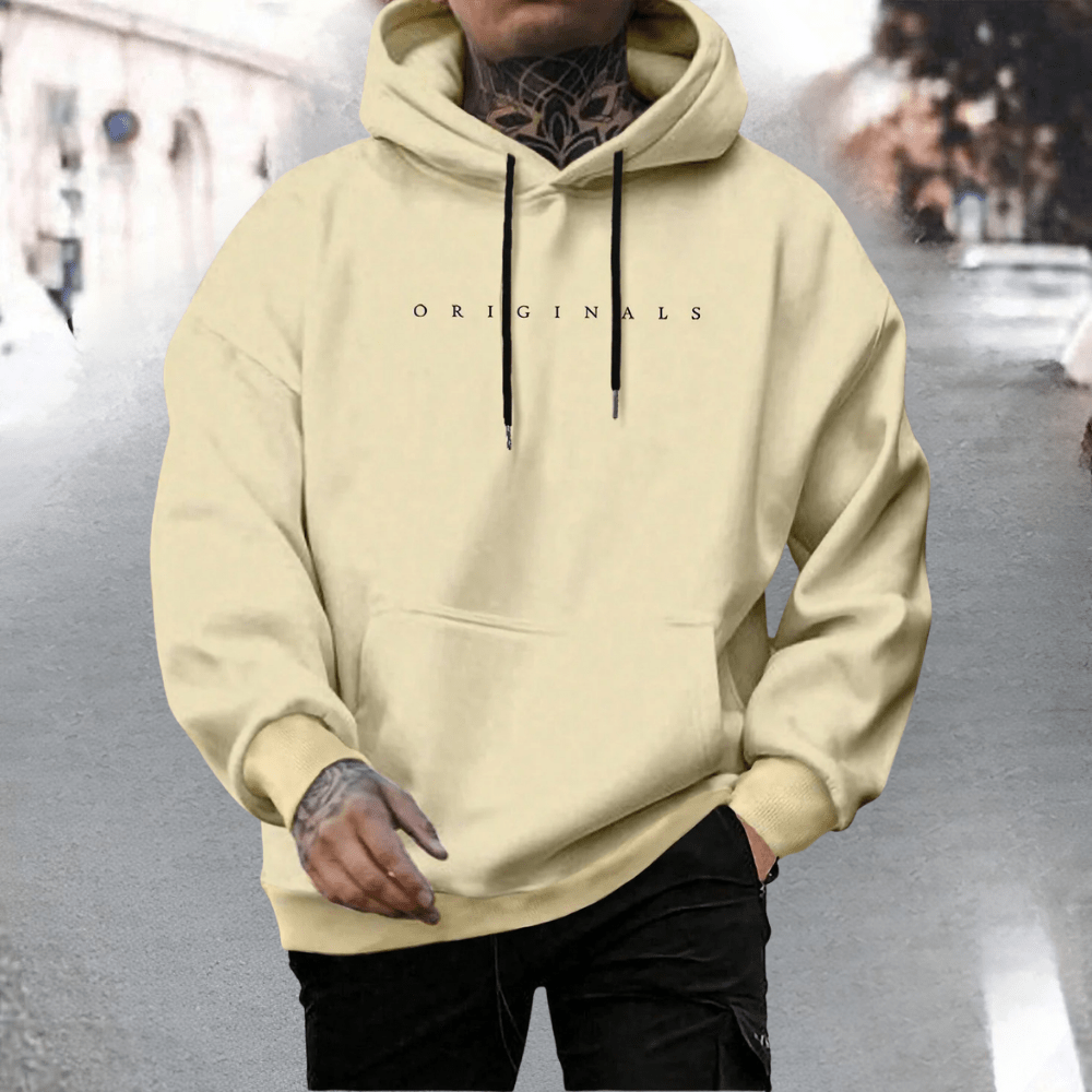 Men's oversized cotton hoodie featuring an adjustable hood and front pocket, ideal for casual wear and comfort. 1