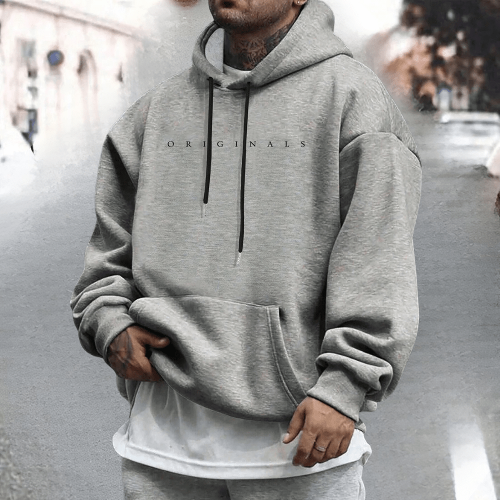 Men's oversized cotton hoodie featuring an adjustable hood and front pocket, ideal for casual wear and comfort. 7