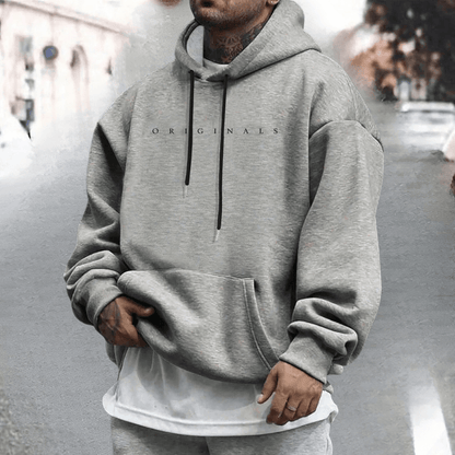 Men's oversized cotton hoodie featuring an adjustable hood and front pocket, ideal for casual wear and comfort. 7