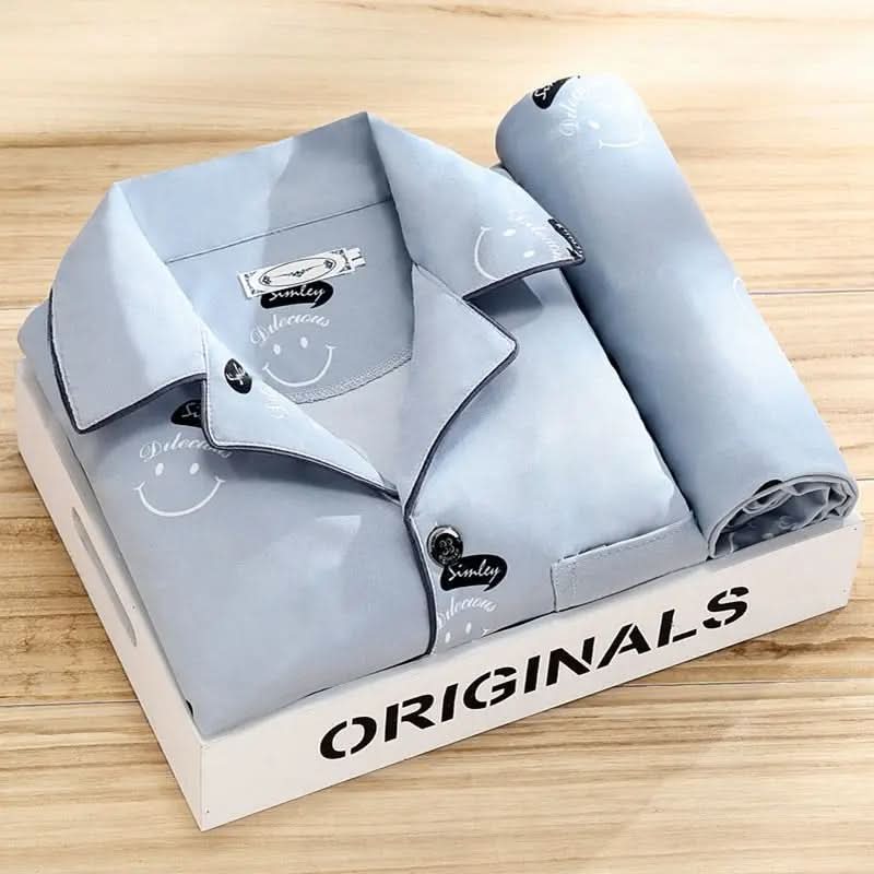 Men's pajama set featuring a button-down shirt and matching pants, designed for year-round comfort with soft, breathable fabric, ideal for restful sleep. 2